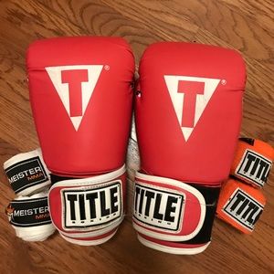 TITLE boxing gloves and two pairs of hand wraps.